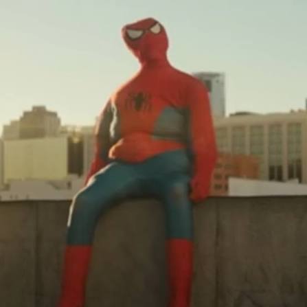 chubby spiderman sitting on a ledge